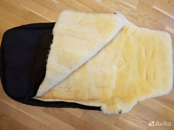 Меховой конверт в коляску фирмы Christ