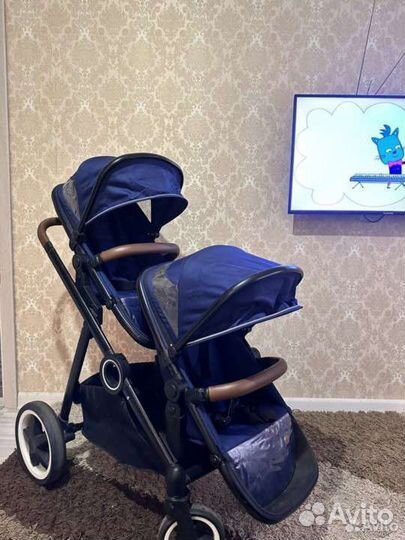 Коляска для двойни погодок