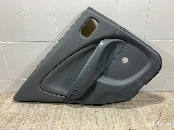 Обшивка двери задняя левая Nissan Almera Classic