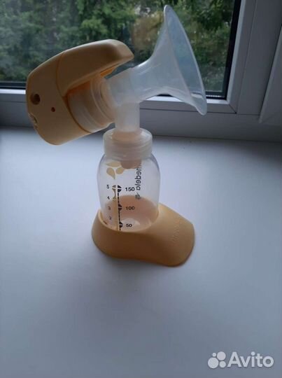 Молокоотсос medela электрический