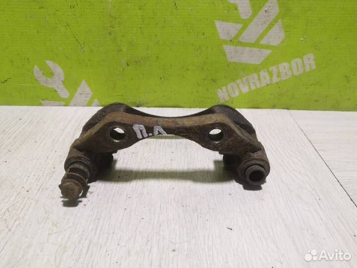 Скоба суппорта переднего Пежо 206