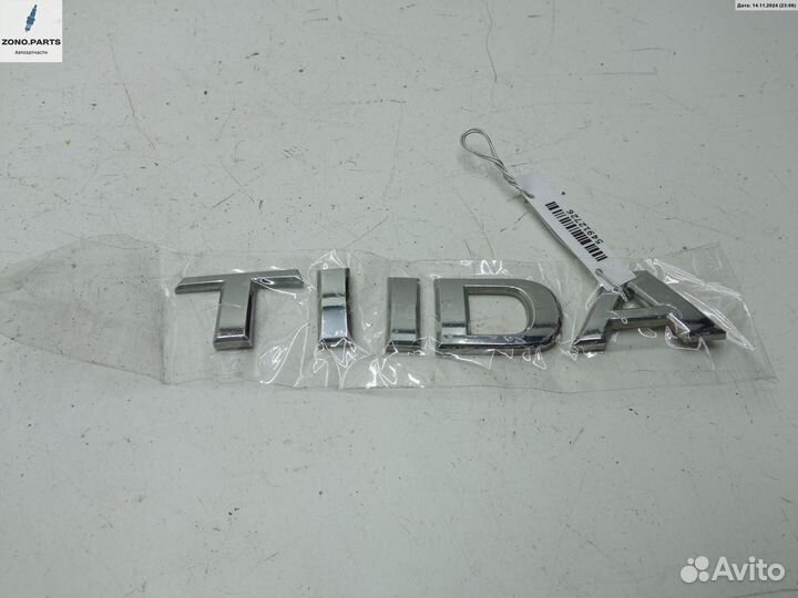 Эмблема на Nissan Tiida