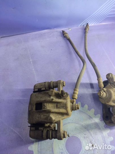 Суппорт тормозной задний Kia Sportage 2