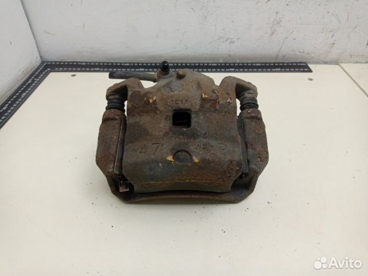 Суппорт тормозной передний правый Nissan Tiida