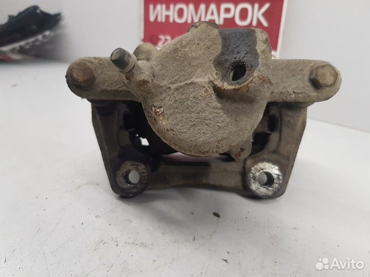 Суппорт (передний левый) (Nissan Almera)