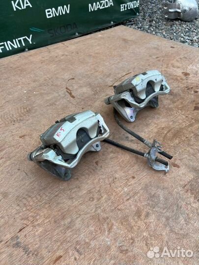 Суппорт тормозной передний Kia K5 DL3 2.5 G4KN