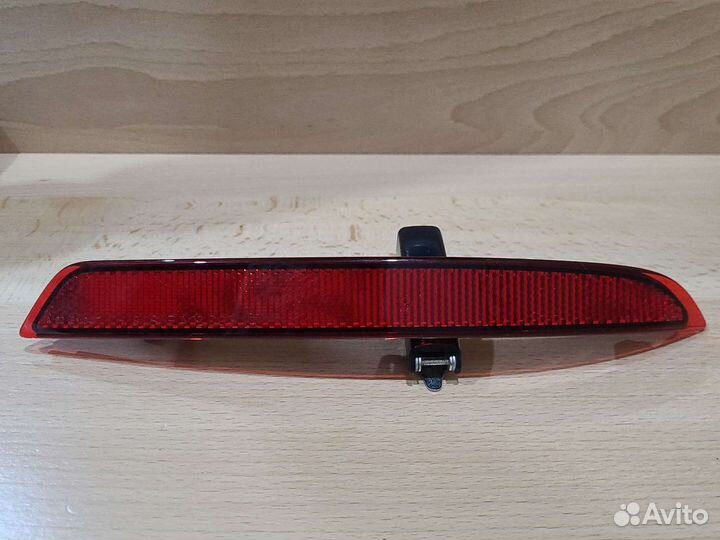 Катафот заднего бампера Opel Astra J