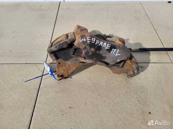 Тормозной суппорт перед лев Chevrolet Нива