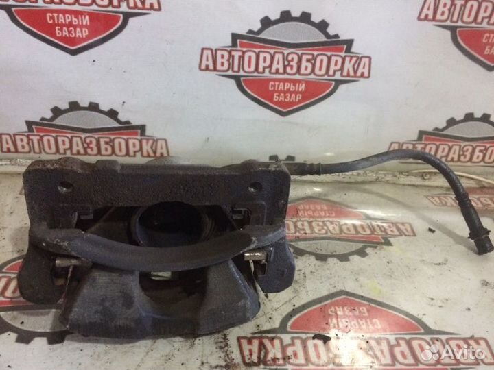 Суппорт тормозной передний левый Toyota Hiace