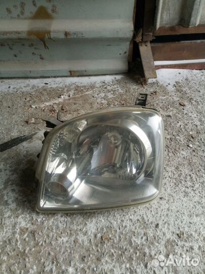 Фара левая mmc dion 100-87473