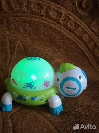 Игрушка каталка Черепаха музыкальная