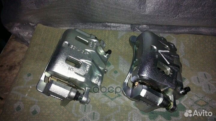 Суппорт тормозной EX5818026A10 Mando