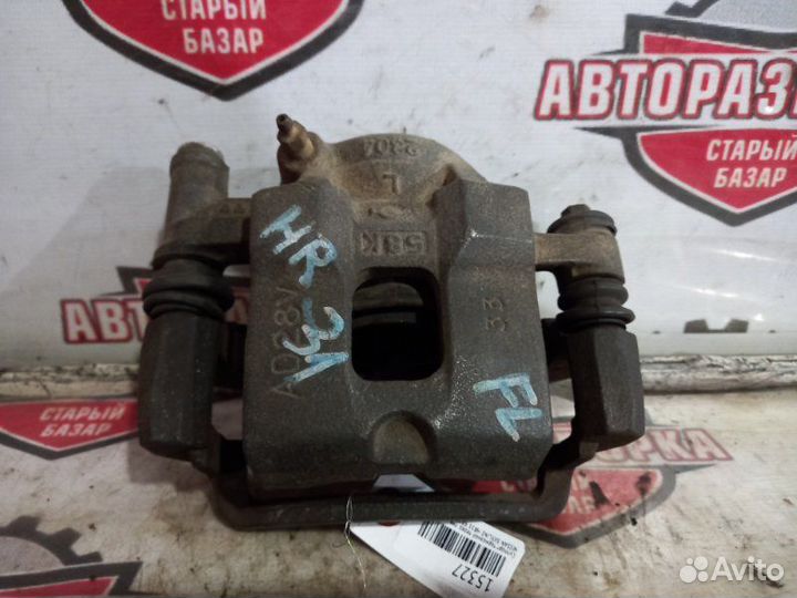 Суппорт тормозной передний левый Nissan Skyline