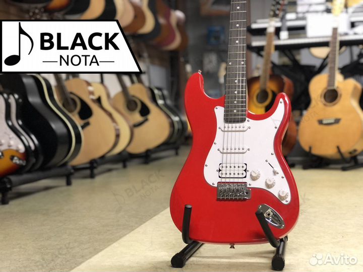 Электрогитара в ярко-красном цвете