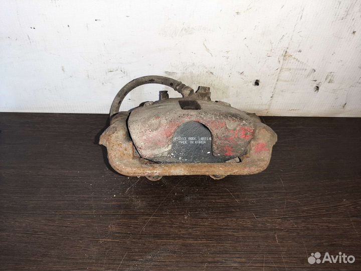 Ssangyong musso суппорт задний левый