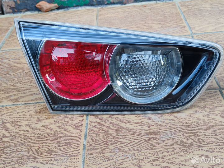 Фонарь крышки багажника lancer 10