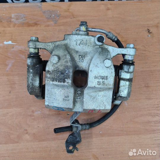 Суппорт тормозной передний левый Kia Sportage 5