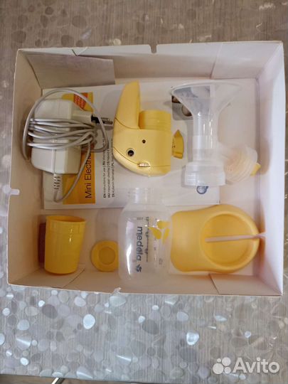 Молокоотсос medela электрический
