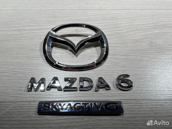 Эмблема Mazda 6