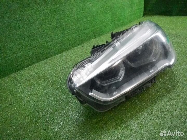 Фара левая BMW X1