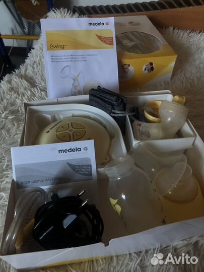 Молокоотсос medela электрический