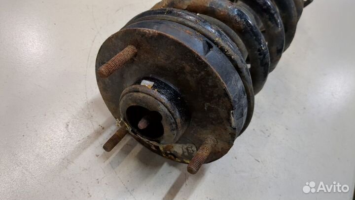 Амортизатор подвески левый передний Chevrolet Tahoe