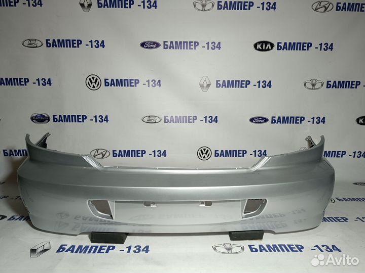 Бампер задний kia spectra серебристый