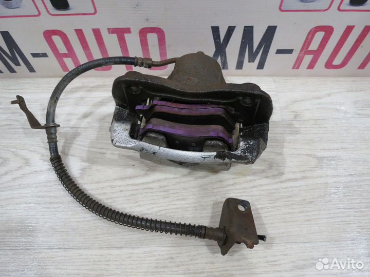 Суппорт тормозной передний левый Kia Rio 3