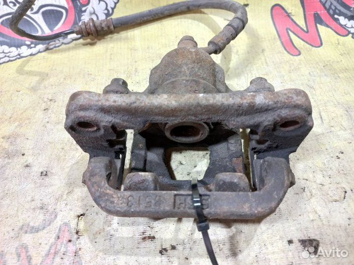 Суппорт тормозной задний левый Nissan Teana J31