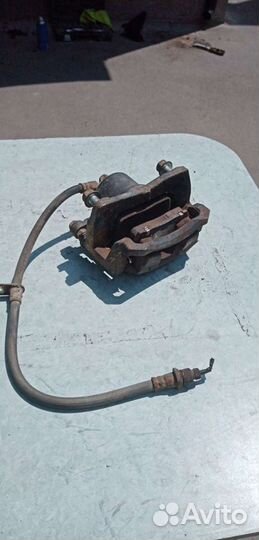 Супорт тормозной передний джили