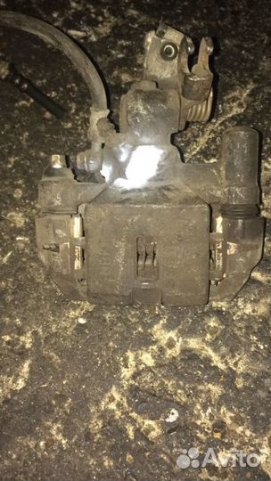 Суппорт задний левый Мазда 626 GE, GF