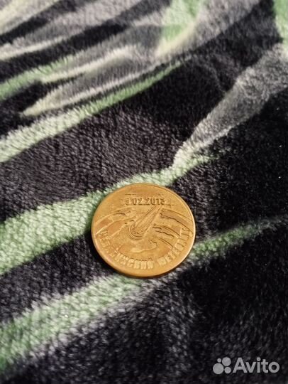 Коллекционная монета с метеоритом