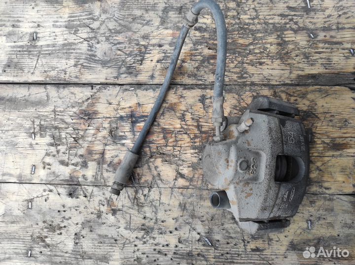 Суппорт передний левый Mazda Demio DY3R DY3W DY5R