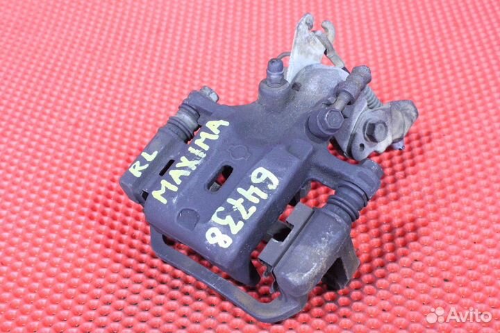 Суппорт тормозной задний левый Nissan Cefiro GF-WA