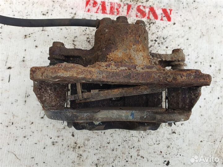 Суппорт передний левый Митсубиши Лансер 9