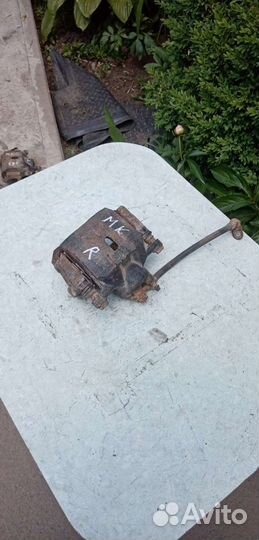 Супорт тормозной передний джили