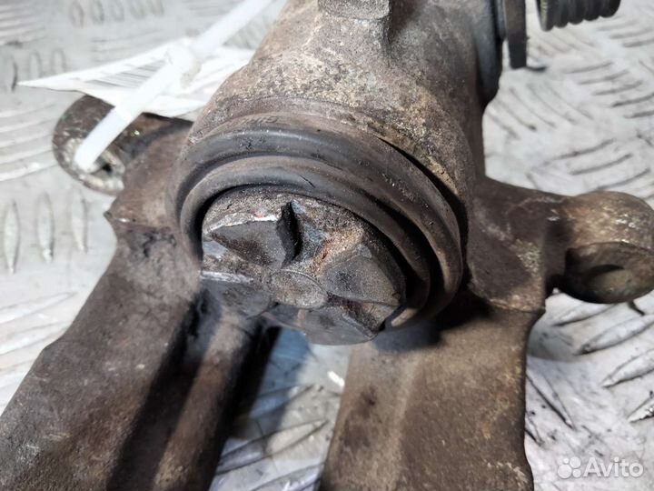 Суппорт задний левый Nissan Almera N16