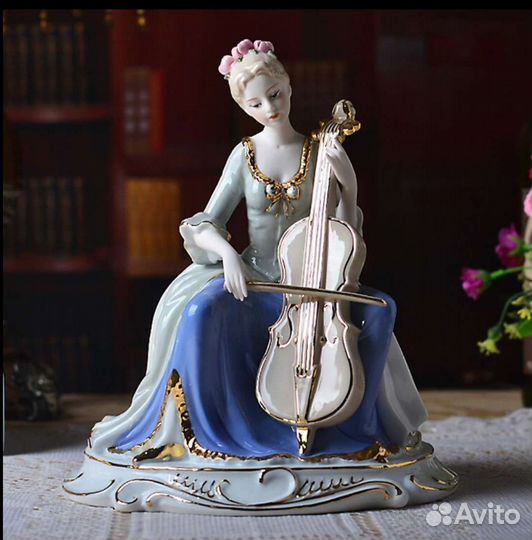 Фарфоровая статуэтка дама с виолончелью