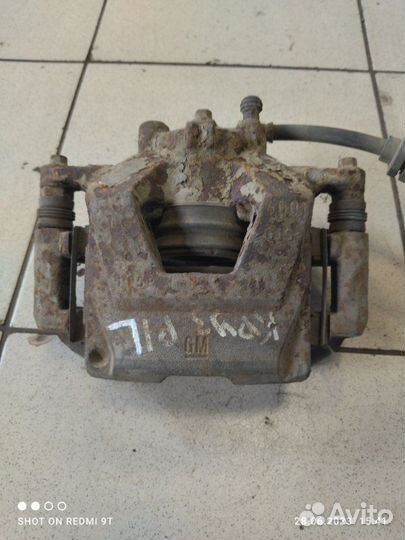 Суппорт тормозной передний левый Chevrolet Cruze