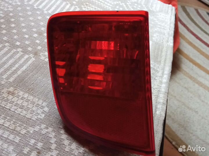 Фонарь левый задний противотуманный Тлк 200