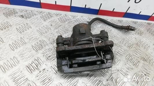 Суппорт тормозной задний левый toyota corolla E12