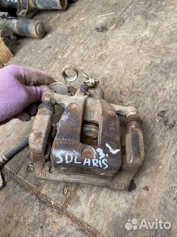 Тормозной супорт задний левый Kia rio 3 Solaris