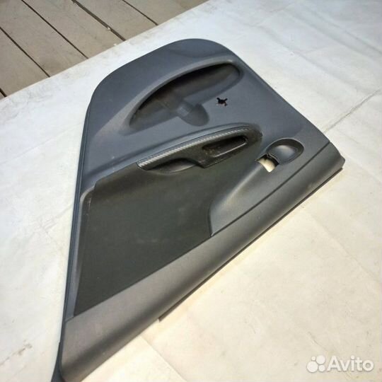Обшивка двери задняя правая Toyota Corolla E150