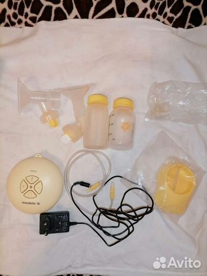 Молокоотсос medela электрический