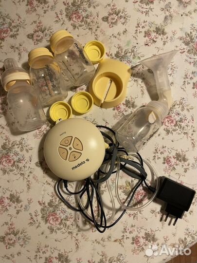Молокоотсос medela электрический