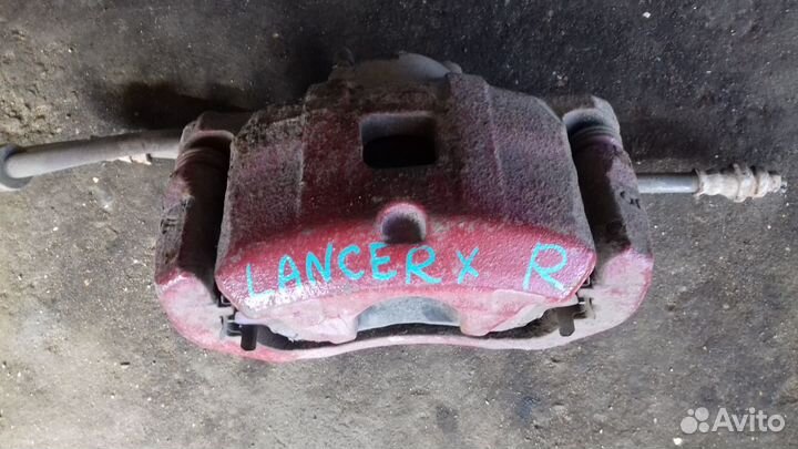 Суппорт передний правый Мицубиши Лансер Х