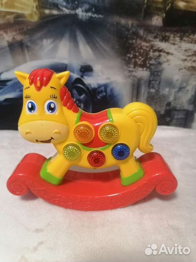 Игрушка лошадка поющая