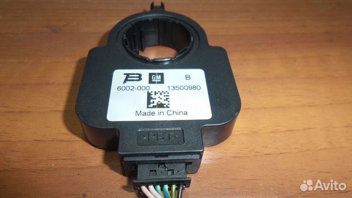 Датчик угла поворота руля Opel Astra J