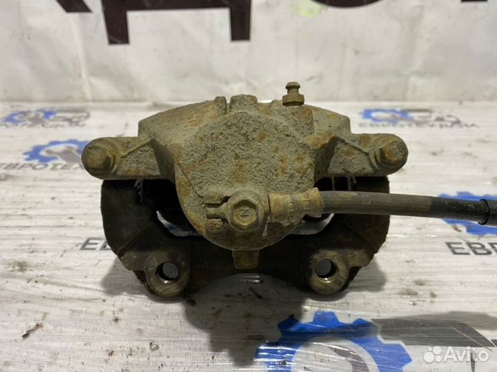 Суппорт передний правый Nissan Primera P12 QG18DE