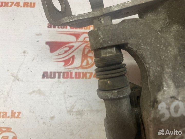 Суппорт тормозной задний левый Mazda 3 BM хетчбек